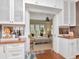 Butler's pantry with bar area, white cabinetry, and a glimpse into the bright living room at 2514 W Morrison Ave, Tampa, FL 33629