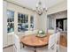 Open and airy dining room featuring large windows with a view of the outside neighborhood at 2514 W Morrison Ave, Tampa, FL 33629