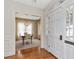 Traditional dining room view from entry showcasing chandelier and wainscoting at 2514 W Morrison Ave, Tampa, FL 33629