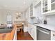 Bright kitchen with stainless steel appliances, banquette seating and a marble backsplash at 2514 W Morrison Ave, Tampa, FL 33629