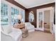 Cozy sitting room features brown walls, neutral furnishings, and ample natural light at 2514 W Morrison Ave, Tampa, FL 33629