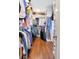 Spacious walk-in closet with custom shelving and hanging rods, providing ample storage for clothes and accessories at 2514 W Morrison Ave, Tampa, FL 33629