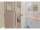 Clean bathroom featuring white cabinets, a vanity, and a walk-in shower at 29636 Tee Shot Dr, San Antonio, FL 33576