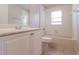 Bright bathroom with a white vanity and an updated tub and shower combination at 29636 Tee Shot Dr, San Antonio, FL 33576