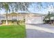 Charming single-story home with a well-manicured lawn and a two-car garage at 29636 Tee Shot Dr, San Antonio, FL 33576