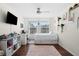 Bright bedroom with natural light, work space and cozy sleeping area at 30045 Southwell Ln, Wesley Chapel, FL 33543