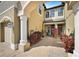 Open air courtyard featuring paver flooring, lush landscaping and access to front doors at 30045 Southwell Ln, Wesley Chapel, FL 33543