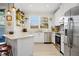 Bright kitchen with stainless steel appliances, granite countertops, and adjacent dining area at 30045 Southwell Ln, Wesley Chapel, FL 33543