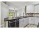 Kitchen featuring stainless steel dishwasher and granite countertops at 3018 Sprawling Oaks Pl, Valrico, FL 33596