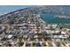 Aerial view of a neighborhood near a lake, pinpointing the property at 305 160Th Ter, Redington Beach, FL 33708