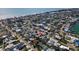 An aerial view showing a neighborhood close to the beach marked with a red pin at 305 160Th Ter, Redington Beach, FL 33708