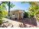 Charming backyard showcasing a brick patio, lush greenery, and a cozy, private outdoor space perfect for relaxation at 305 160Th Ter, Redington Beach, FL 33708