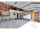 Spacious garage with laundry, storage shelves, and overhead storage at 305 160Th Ter, Redington Beach, FL 33708