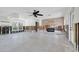 Vast open living space with exposed walls ready for customization and featuring a stylish fireplace at 305 160Th Ter, Redington Beach, FL 33708