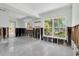 Open-concept living area with multiple windows and ample natural light, perfect for entertaining at 305 160Th Ter, Redington Beach, FL 33708