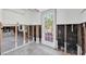 Bright living space with windowed door and large windows overlooking outdoor landscaping at 305 160Th Ter, Redington Beach, FL 33708