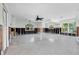 Bright, expansive living area with large windows, and concrete floors ready for renovation at 305 160Th Ter, Redington Beach, FL 33708
