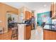 Eat in kitchen with tile floors and stainless steel refrigerator at 31836 Stillmeadow Dr, Wesley Chapel, FL 33543