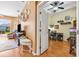 Inviting living room flowing into the office with a ceiling fan and lots of natural light at 31836 Stillmeadow Dr, Wesley Chapel, FL 33543