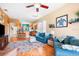 Open-concept living space with hardwood floors and views into the eat in kitchen at 31836 Stillmeadow Dr, Wesley Chapel, FL 33543