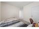 Neutral bedroom with carpet, a wooden bed frame, white walls and door at 31923 Treasure Dock Isle, Wesley Chapel, FL 33545