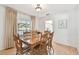 Dining room with hardwood floors, natural light, table set for six at 3604 Southview Ct, Brandon, FL 33511