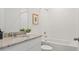 Bright bathroom features granite countertops, white cabinets and tile backsplash at 3637 Moscato Dr, Brooksville, FL 34602