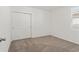 Neutral bedroom features carpet flooring and closet with sliding doors at 3637 Moscato Dr, Brooksville, FL 34602