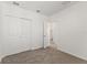 Neutral bedroom features carpet flooring and double door closet at 3637 Moscato Dr, Brooksville, FL 34602