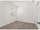 Neutral bedroom features carpet flooring, window and walk-in closet at 3637 Moscato Dr, Brooksville, FL 34602
