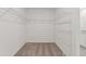 Spacious walk-in closet featuring carpeted floor and wire shelving at 3637 Moscato Dr, Brooksville, FL 34602