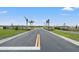 Gated community entrance with stone pillars and lush landscaping at 3637 Moscato Dr, Brooksville, FL 34602