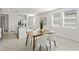 Dining room with contemporary table and chairs, and natural light at 3637 Moscato Dr, Brooksville, FL 34602