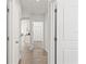 Hallway with tile flooring leading to the kitchen and bedroom at 3637 Moscato Dr, Brooksville, FL 34602
