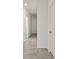 Hallway with tile flooring and white doors at 3637 Moscato Dr, Brooksville, FL 34602