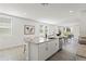 Open kitchen with large island featuring granite countertop and stainless steel dishwasher at 3637 Moscato Dr, Brooksville, FL 34602