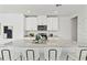Modern kitchen featuring a granite countertop island with barstool seating at 3637 Moscato Dr, Brooksville, FL 34602