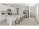 The kitchen features a granite countertop island with barstool seating and stainless steel appliances at 3637 Moscato Dr, Brooksville, FL 34602