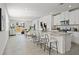Open-concept kitchen and living area with a large island and seating for four at 3637 Moscato Dr, Brooksville, FL 34602