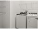 Well-lit laundry room with modern washer and dryer at 3637 Moscato Dr, Brooksville, FL 34602