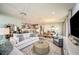 Open-concept living space with a seamless flow from the living room to the kitchen and dining area at 3915 Farm Garden Ct, Lakewood Ranch, FL 34211