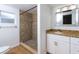 Bathroom featuring granite countertops, a tiled shower and white cabinets at 4162 3Rd N Ave, St Petersburg, FL 33713