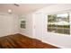 Bedroom featuring wood floors and natural lighting from windows with white trim at 4162 3Rd N Ave, St Petersburg, FL 33713