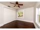 Bright bedroom with hardwood floors, a ceiling fan, and a closet at 4162 3Rd N Ave, St Petersburg, FL 33713