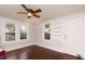 Bright bedroom features hardwood floors, a ceiling fan, and an abundance of natural light at 4162 3Rd N Ave, St Petersburg, FL 33713