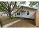 Charming home exterior featuring a walkway and beautiful trees and landscaping at 4162 3Rd N Ave, St Petersburg, FL 33713