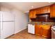 Kitchen with wooden cabinets, granite countertops, and stainless steel appliances at 4162 3Rd N Ave, St Petersburg, FL 33713