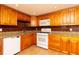 Kitchen featuring wooden cabinets, granite counters, and stainless steel appliances at 4162 3Rd N Ave, St Petersburg, FL 33713
