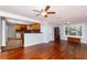 Living room featuring hardwood floors, kitchen view, and natural light from window at 4162 3Rd N Ave, St Petersburg, FL 33713