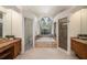 Bathroom featuring dual vanities, separate shower, and luxurious soaking tub at 4324 Auston Way, Palm Harbor, FL 34685